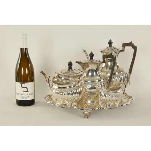 331 - AN EDWARD VII FIVE PIECE SILVER TEA SERVICE TOGETHER WITH A SILVER PLATED SALVER of oblate swirl-flu... 