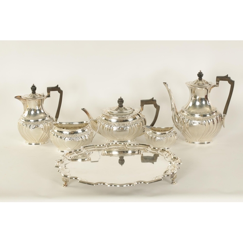 331 - AN EDWARD VII FIVE PIECE SILVER TEA SERVICE TOGETHER WITH A SILVER PLATED SALVER of oblate swirl-flu... 