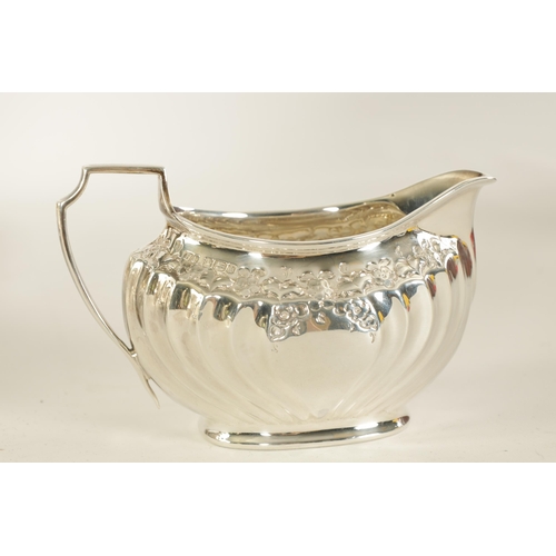 331 - AN EDWARD VII FIVE PIECE SILVER TEA SERVICE TOGETHER WITH A SILVER PLATED SALVER of oblate swirl-flu... 