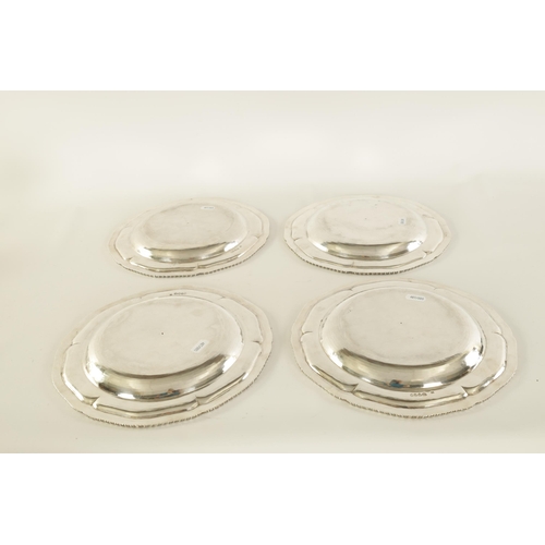 335 - A SET OF FOUR EARLY VICTORIAN SILVER SECOND COURSE DISHES the scalloped feather-edge reeded rims enc... 