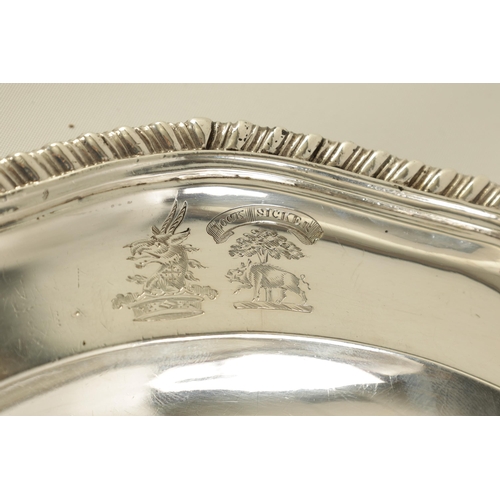 335 - A SET OF FOUR EARLY VICTORIAN SILVER SECOND COURSE DISHES the scalloped feather-edge reeded rims enc... 