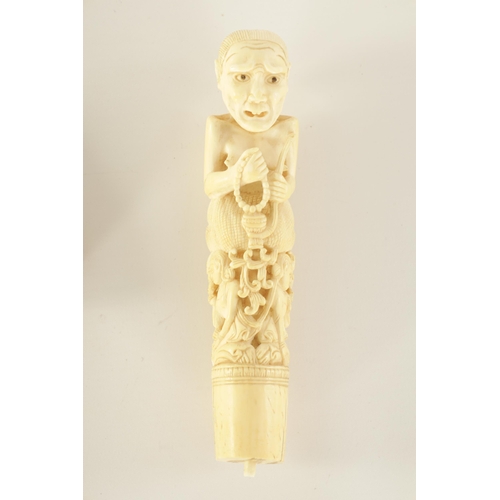 342 - FOUR 19TH CENTURY CARVED IVORY STICK HANDLES together with an ivory and amber cheroot holder.