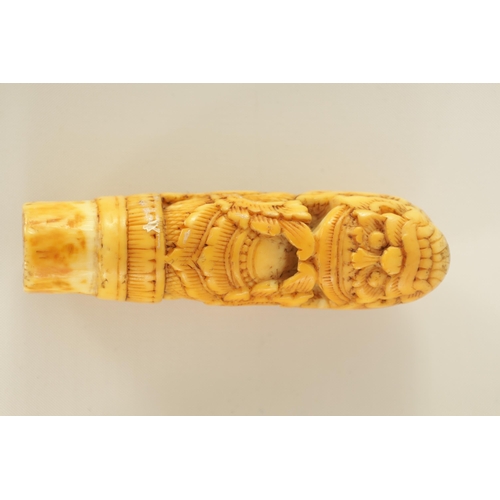 342 - FOUR 19TH CENTURY CARVED IVORY STICK HANDLES together with an ivory and amber cheroot holder.