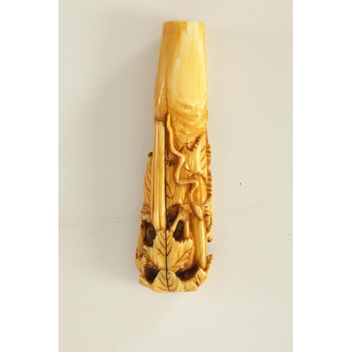 342 - FOUR 19TH CENTURY CARVED IVORY STICK HANDLES together with an ivory and amber cheroot holder.