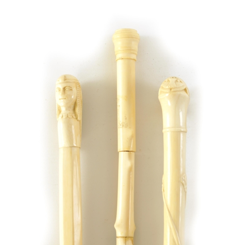 344 - TWO LATE 19TH CENTURY CARVED IVORY EGYPTIAN-REVIVAL PARASOL HANDLES one of a scarab, the other of a ... 