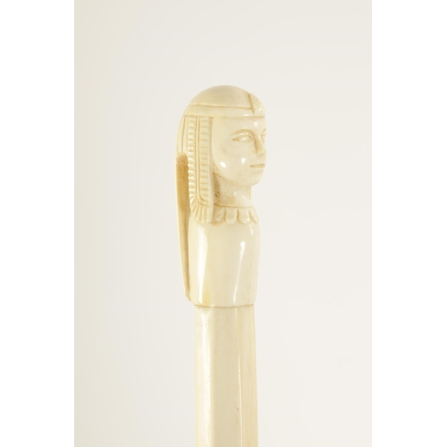 344 - TWO LATE 19TH CENTURY CARVED IVORY EGYPTIAN-REVIVAL PARASOL HANDLES one of a scarab, the other of a ... 