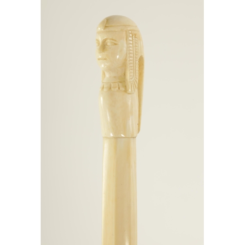 344 - TWO LATE 19TH CENTURY CARVED IVORY EGYPTIAN-REVIVAL PARASOL HANDLES one of a scarab, the other of a ... 