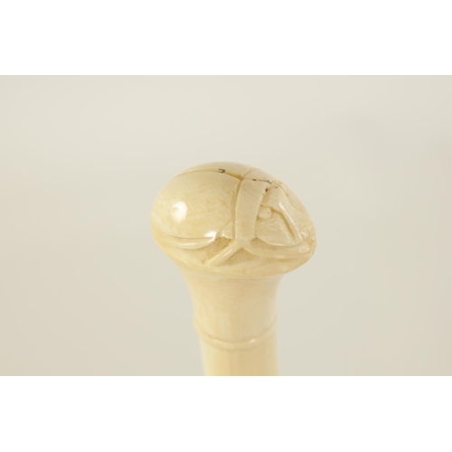 344 - TWO LATE 19TH CENTURY CARVED IVORY EGYPTIAN-REVIVAL PARASOL HANDLES one of a scarab, the other of a ... 