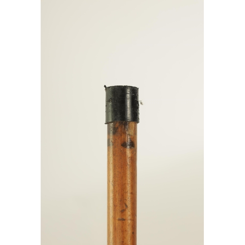 346 - A 19TH CENTURY CARVED IVORY AND MALACA ‘SEVEN FACES’ WALKING STICK with carved handle and tapering s... 