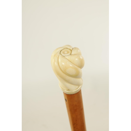 347 - A 19TH CENTURY CARVED IVORY AND MALACA WALKING STICK with twisted carved pommel handle. (87cm overal... 