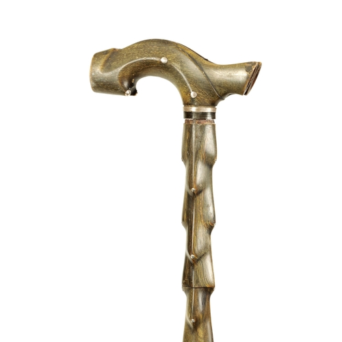 349 - A 19TH CENTURY SEGMENTED HORN WALKING STICK with silver studded decoration (89cm overall )