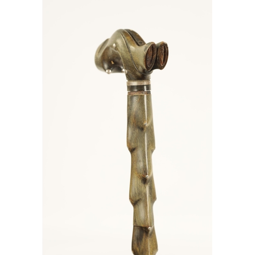 349 - A 19TH CENTURY SEGMENTED HORN WALKING STICK with silver studded decoration (89cm overall )