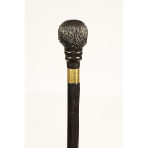 352 - A LATE 19TH CENTURY CARVED EBONY WALKING STICK depicting a bearded man with glass eyes (86.5cm overa... 