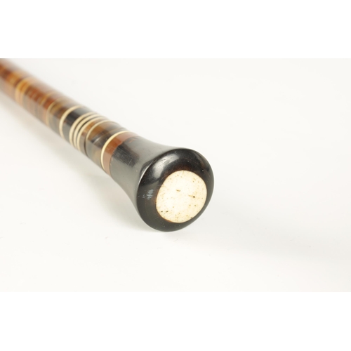 353 - A LATE 19TH CENTURY SECTIONAL HORN WALKING STICK constructed of layered tapering discs with shaped p... 