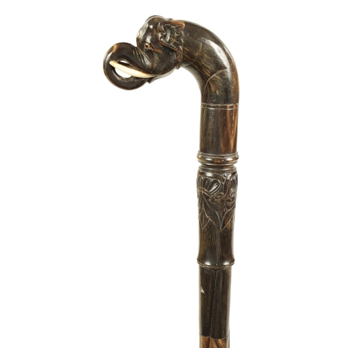 355 - A 19TH CENTURY ANGLO INDIAN SEGMENTED HORN WALKING STICK possibly rhinoceros horn, of twisted design... 