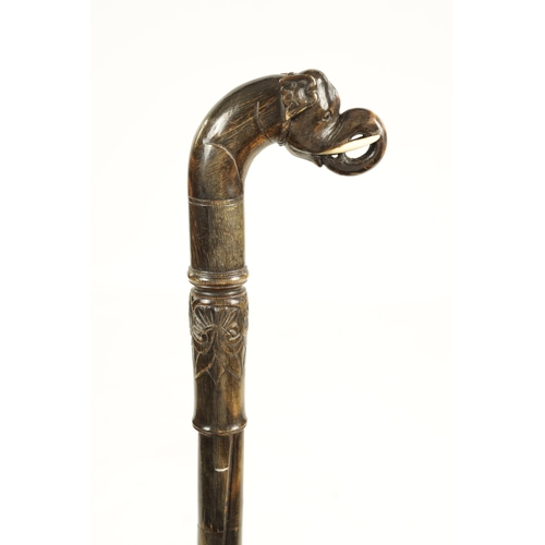 355 - A 19TH CENTURY ANGLO INDIAN SEGMENTED HORN WALKING STICK possibly rhinoceros horn, of twisted design... 