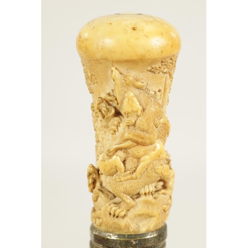 356 - A 19TH CENTURY CARVED IVORY AND MALACCA WALKING STICK the handle finely carved depicting a bear bein... 