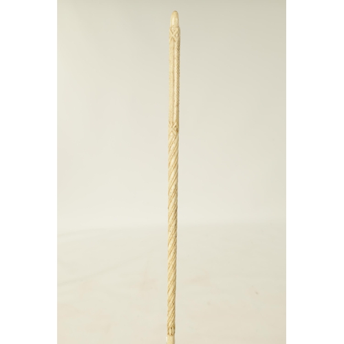 361 - AN EARLY 19TH CENTURY CARVED WHALEBONE WALKING STICK of tapered form with spirally carved design. (8... 