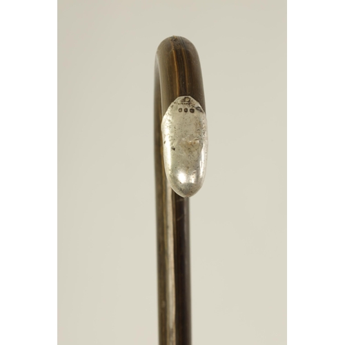 367 - A LATE 19TH CENTURY RHINOCEROS HORN SILVER MOUNTED WALKING STICK with hoop handle and silver mounts.... 