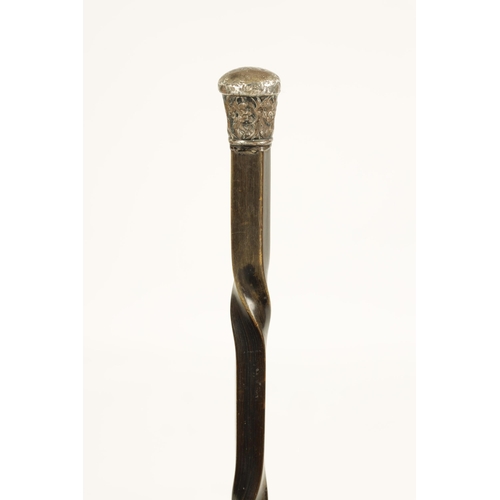 371 - A 19TH CENTURY BLACK RHINOCEROS HORN WALKING STICK with embossed silver handle and twisted tapering ... 