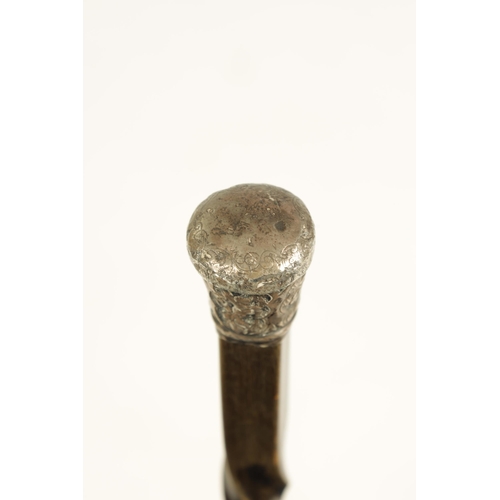 371 - A 19TH CENTURY BLACK RHINOCEROS HORN WALKING STICK with embossed silver handle and twisted tapering ... 