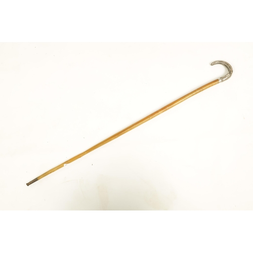 373 - A LATE 19TH CENTURY RHINOCEROS HORN SILVERED METAL MOUNTED WALKING STICK with branch effect tapering... 