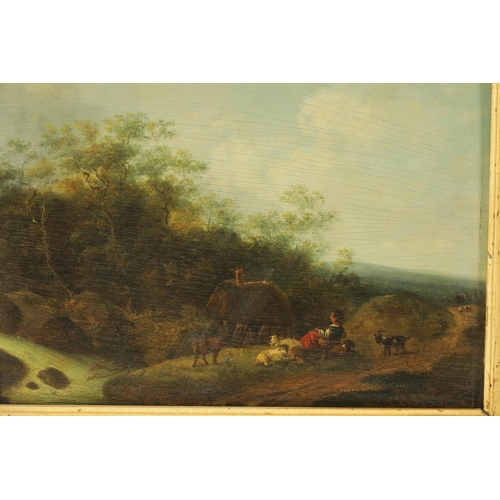 380 - AN EARLY 19TH CENTURY OIL ON BOARD depiciting a country landscape with cottage and shepherdess to th... 