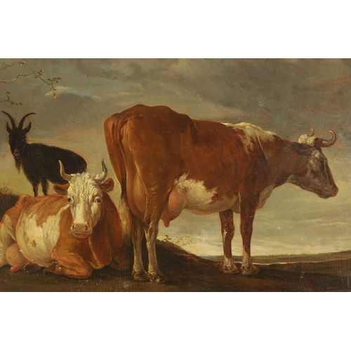 418 - 19TH CENTURY OIL ON BOARD IN THE MANNER OF PAULUS POTTER depicting cattle and a goat in an open land... 