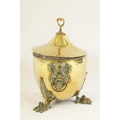 448 - A 19TH CENTURY ADAM STYLE URN SHAPED BRASS COAL BUCKET with shaped leaf cast handle above a pair of ... 