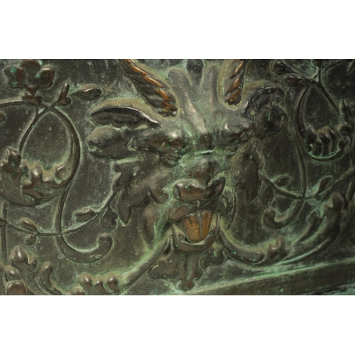 449 - A LARGE 19TH CENTURY EMBOSSED BRASS JARDINERE of rounded-end rectangular form with raised moulded ba... 