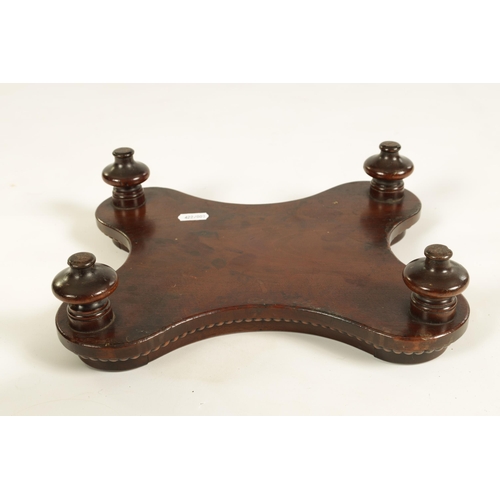 453 - A LATE GEORGIAN MAHOGANY TABLE URN STAND IN THE MANNER OF GILLOWS of all-round serpentine outline wi... 