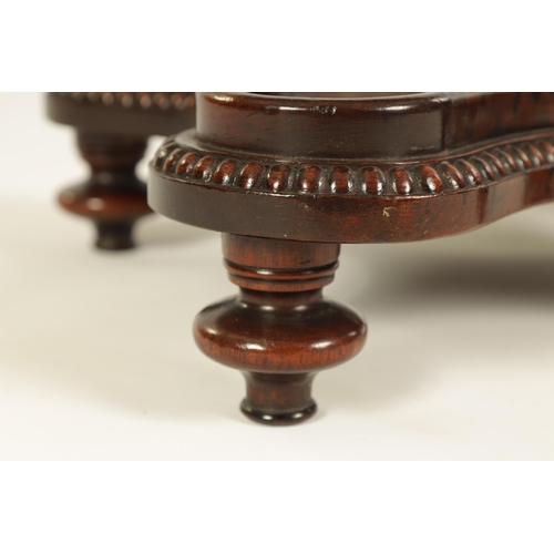 453 - A LATE GEORGIAN MAHOGANY TABLE URN STAND IN THE MANNER OF GILLOWS of all-round serpentine outline wi... 