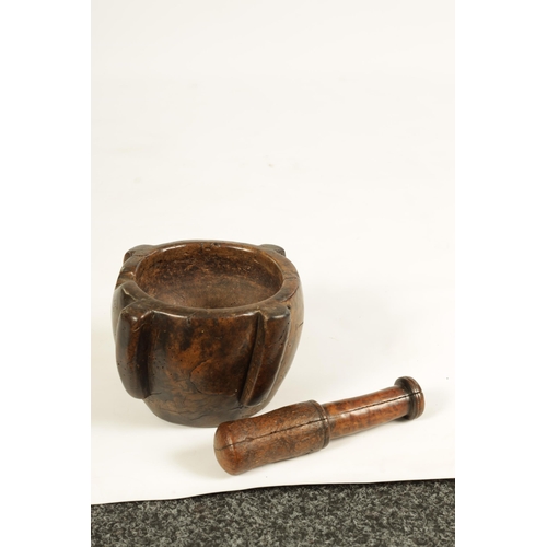 454 - AN EARLY 16TH/17TH CENTURY BURR WALNUT PESTLE AND MORTAR of deep four lugged form with rounded body ... 