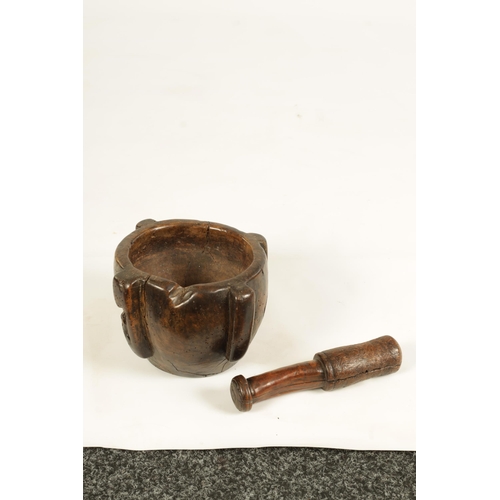 454 - AN EARLY 16TH/17TH CENTURY BURR WALNUT PESTLE AND MORTAR of deep four lugged form with rounded body ... 