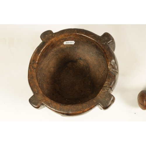 454 - AN EARLY 16TH/17TH CENTURY BURR WALNUT PESTLE AND MORTAR of deep four lugged form with rounded body ... 