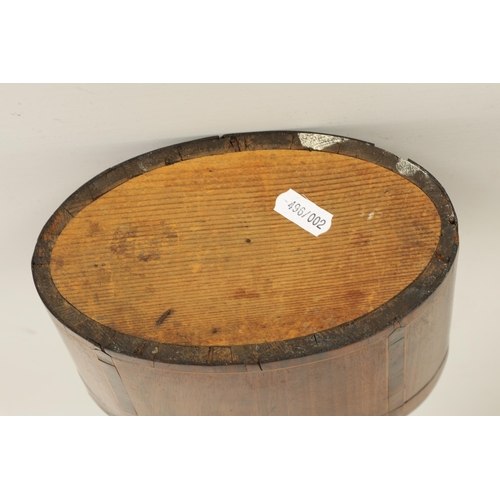 463 - A GEORGE III OVAL INLAID MAHOGANY TEA CADDY with oval fanned inlay and rosewood cross-banded boxwood... 