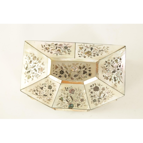 472 - A 19TH CENTURY INLAID MOTHER OF PEARL TEA CADDY of canted angled form decorated with fine contrastin... 