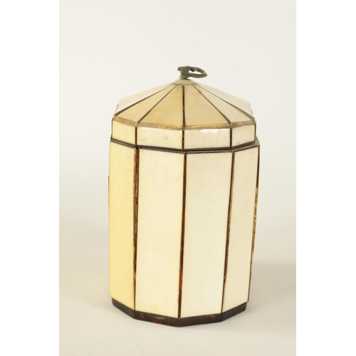 475 - A GEORGIAN PANELLED IVORY AND TORTOISESHELL DECAGONAL ‘TENT TOP’ TEA CADDY with silver axe-drop hand... 