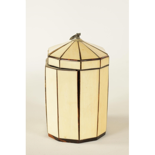 475 - A GEORGIAN PANELLED IVORY AND TORTOISESHELL DECAGONAL ‘TENT TOP’ TEA CADDY with silver axe-drop hand... 