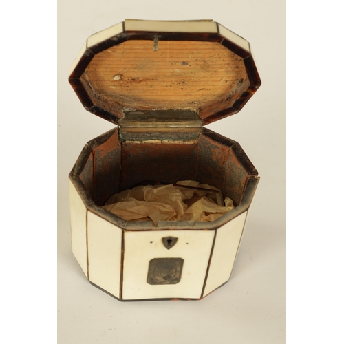 475 - A GEORGIAN PANELLED IVORY AND TORTOISESHELL DECAGONAL ‘TENT TOP’ TEA CADDY with silver axe-drop hand... 