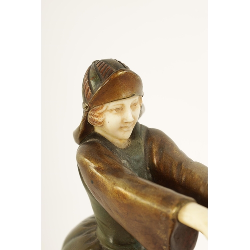 493 - AN ART DECO FIGURAL BRONZE AND IVORY SCULPTURE depicting a boy and a girl dancing with a ring of ros... 