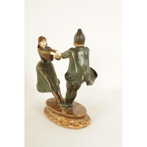 493 - AN ART DECO FIGURAL BRONZE AND IVORY SCULPTURE depicting a boy and a girl dancing with a ring of ros... 