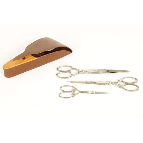 495 - TWO CASES OF JOSEPH RODGERS TRAVELLING SALESMAN'S SCISSORS each case of varying design - six in tota... 