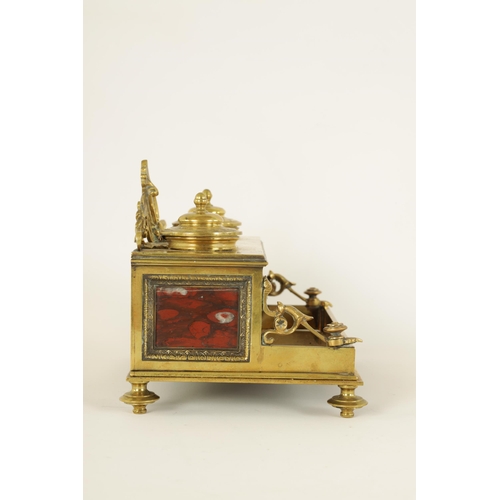 497 - A 19TH CENTURY BRASS AND ROUGE MARBLE DESK STAND the raised back with centre cresting and fitted dou... 