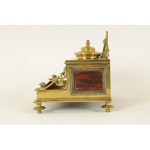 497 - A 19TH CENTURY BRASS AND ROUGE MARBLE DESK STAND the raised back with centre cresting and fitted dou... 