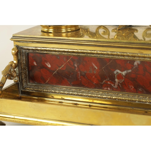 497 - A 19TH CENTURY BRASS AND ROUGE MARBLE DESK STAND the raised back with centre cresting and fitted dou... 