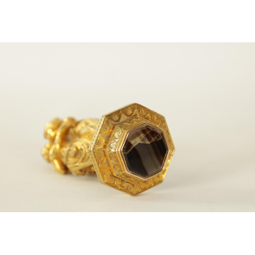 498 - A 19TH CENTURY FRENCH GILT BRONZE SEAL with classical figural handle above a tapering angled base in... 