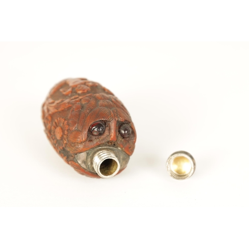 508 - A FINELY CARVED 19TH CENTURY FRENCH COQUILLA NUT SCENT FLASK the tear-drop body decorated with winge... 