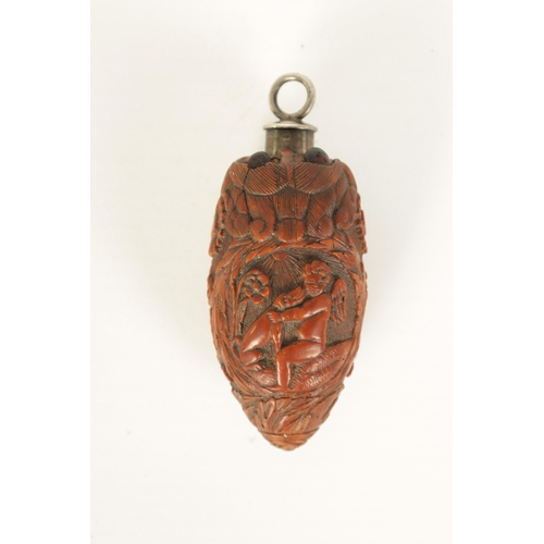 508 - A FINELY CARVED 19TH CENTURY FRENCH COQUILLA NUT SCENT FLASK the tear-drop body decorated with winge... 