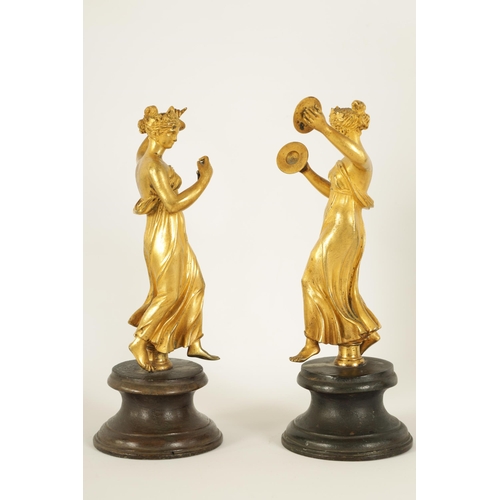 513 - A PAIR OF 19TH CENTURY FIGURAL GILT BRONZE SCULPTURES modelled as classical maidens playing symbols ... 